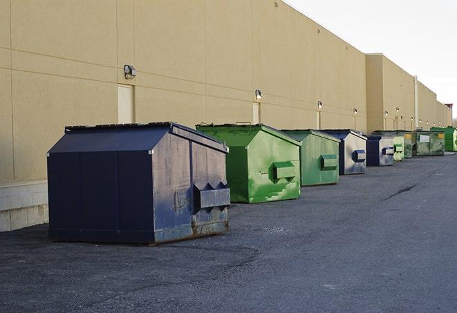 dumpsters lined up for use on busy construction site in Amityville